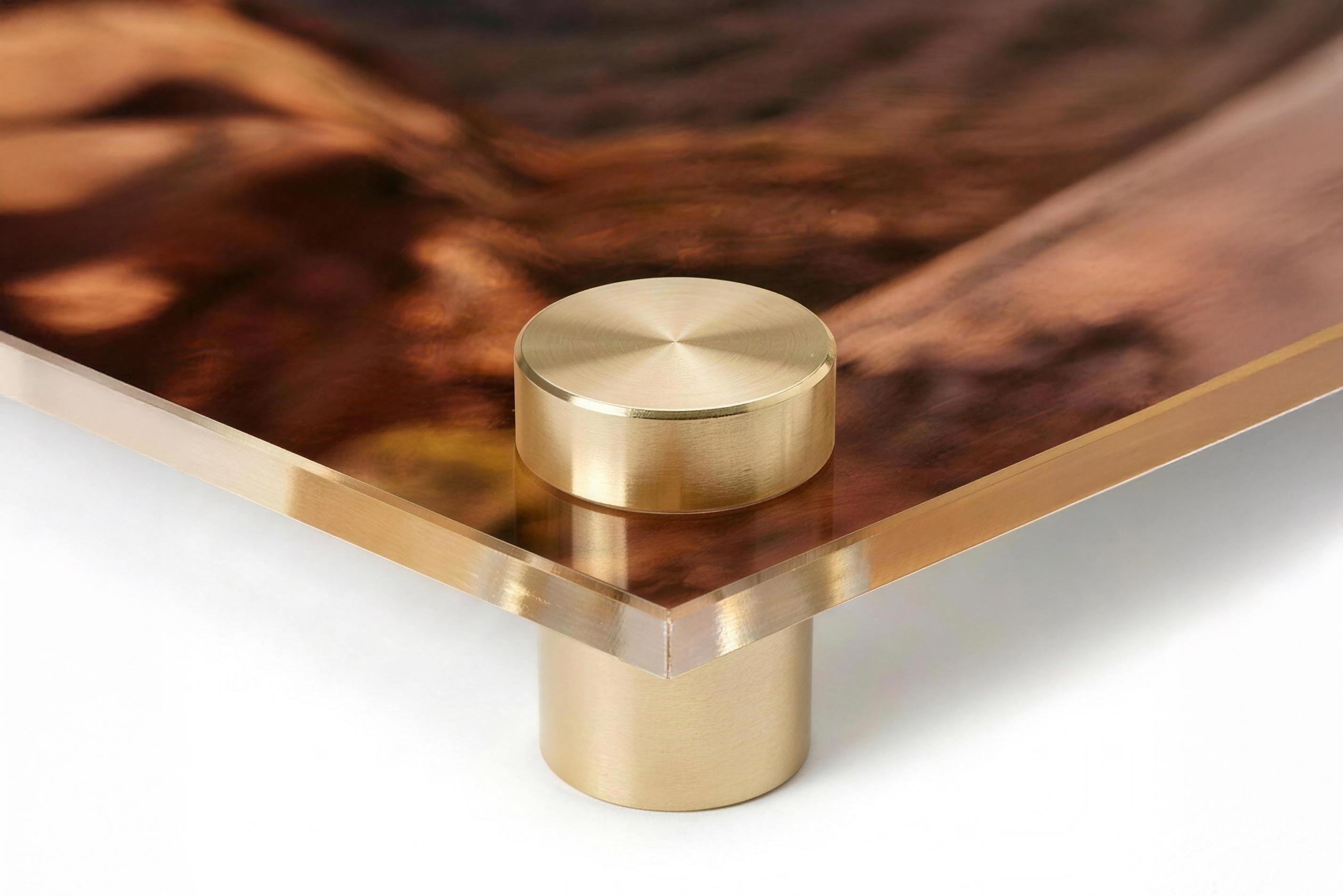 Close-up of an acrylic print corner showing the polished edge and the image sitting beneath the surface